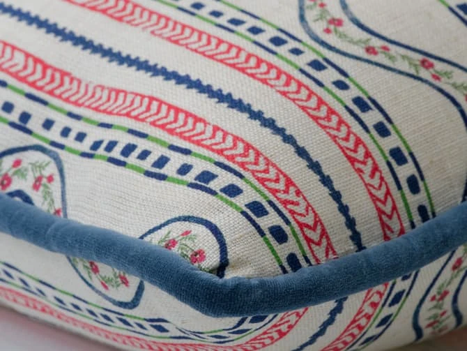 A cushion of bright stripes with folkloric flair A Cushion Of Bright Stripes With Folkloric Flair -Andrew Martin Store 1095464 flow pink cushion corner sml