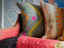Striking Patterned Cushion -Andrew Martin Store 1095954 regal sofa turkisk weave diego charcoal freida sand cushions close up sml