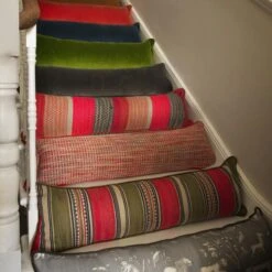 Sorrento Draught Excluder Cushion -Andrew Martin Store 352728 draught excluder stair group shot sml