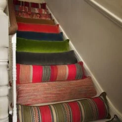 Medici Raw Umber Draught Excluder Cushion 3 Medici Raw Umber Draught Excluder Cushion -Andrew Martin Store 353167 draught excluder stair group shot sml